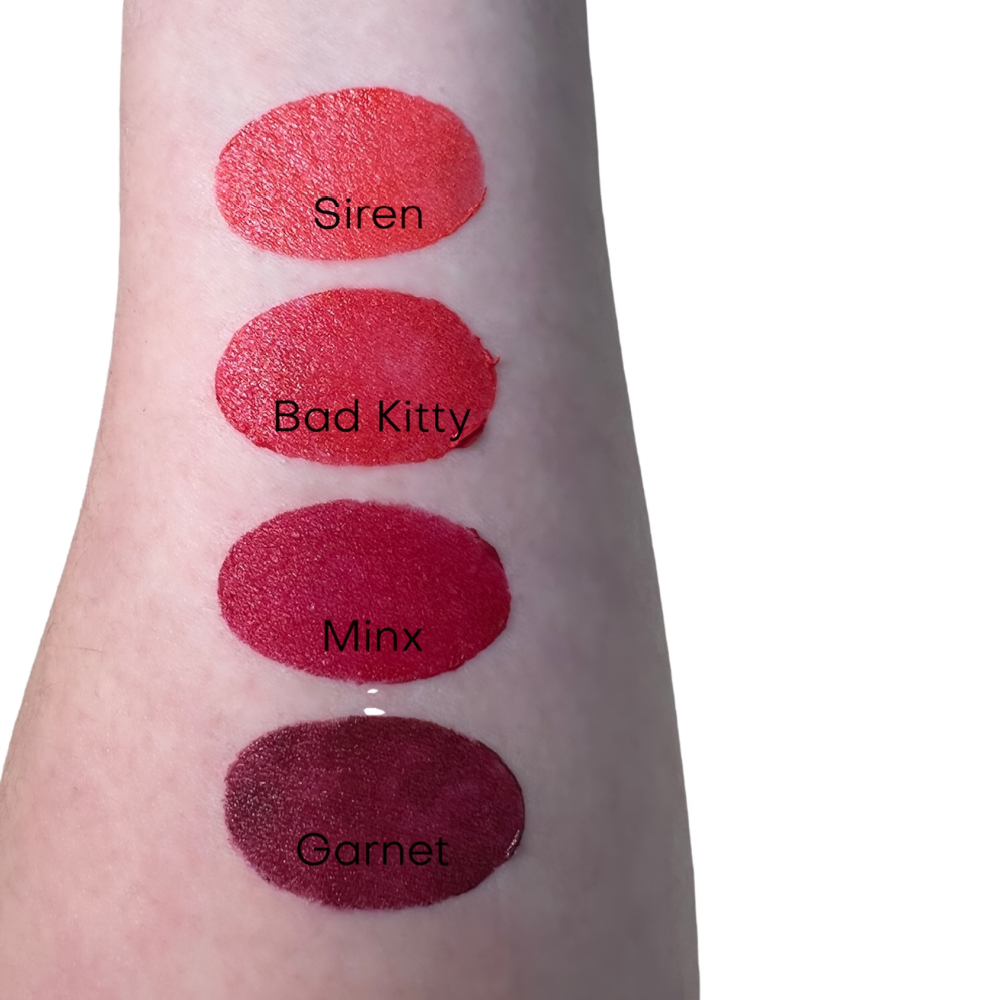 red lipstick swatch on arm