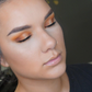 Orange eyeshadow on model. New Zealand made makeup